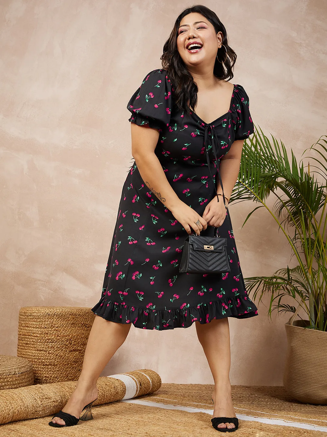 Berrylush Women Plus Size Black & Red Cherry Printed Sweetheart Neck Front Tie-Up Flounce Hem A-Line Midi Dress